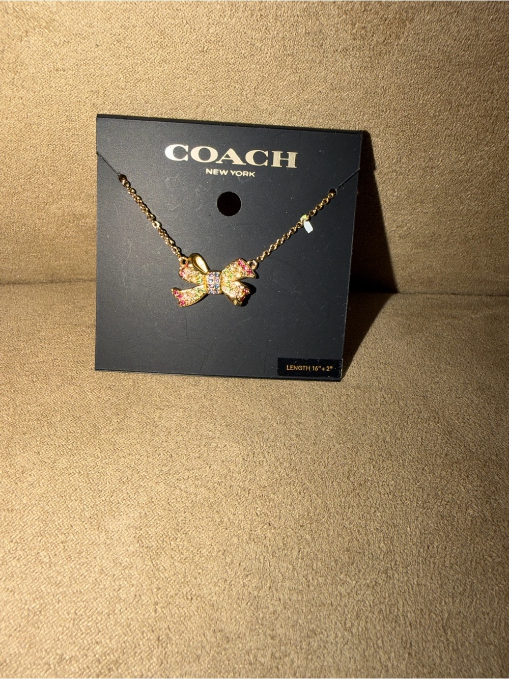 Coach Gold Bow Necklace with Pink and Clear Crystals